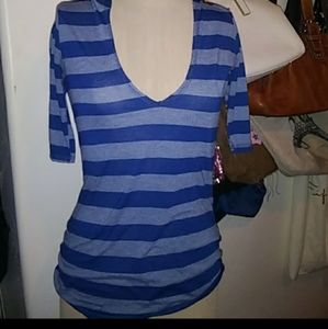 A Stripped v neck shirt with a Hoodie